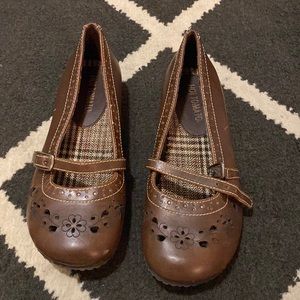 Brown leather flat slip shoe with strap